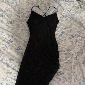 Black fitted dress with sparkly floral designs